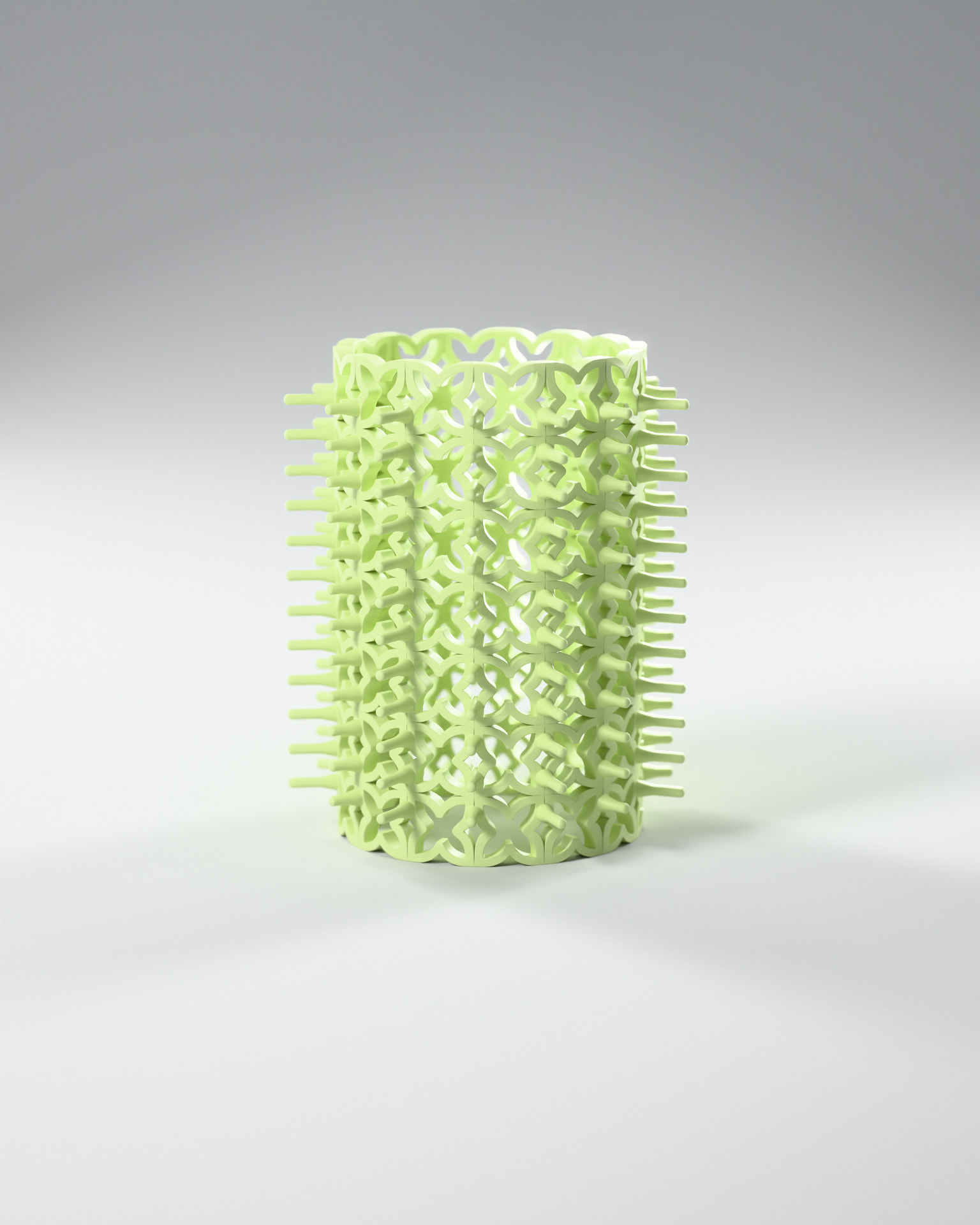 Macro close-up of the Matcha Latte Crazy Curler on a grey studio background